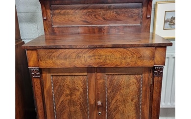 Of Superb quality. An early 19th Century Mahogany two door C...