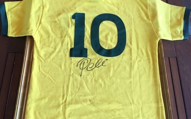 PELE: (1940- ) Brazilian Footballer. A retro Brazil gold and green cotton football jersey, with embr...