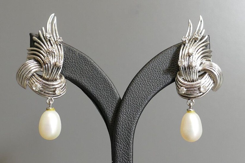 Pair of 18 karat white gold ear clips set with diamonds retaining a mobile pearl