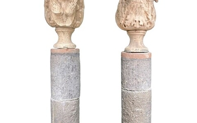 Pair of columns, surmounted by 17th century vases, depicting a woman and an eagle