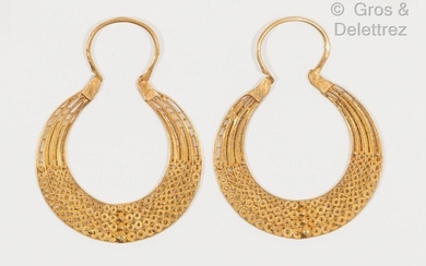 Pair of yellow gold creoles finely chased and openworked with...