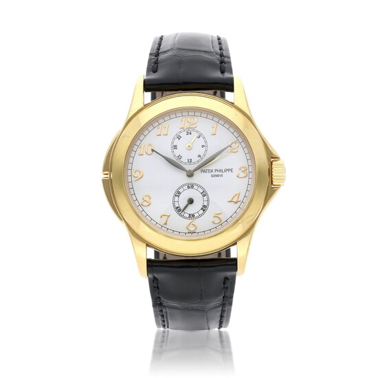 Patek Philippe Reference 5134J-001 Travel Time | Retailed by Tiffany & Co.: A yellow gold dual time wristwatch with 24-hour indication, Circa 2005