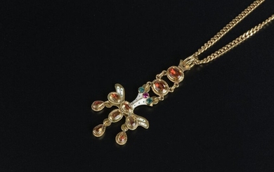 18k yellow gold pendant depicting the white enamelled Holy Spirit dove, set with six oval orange stones, two small green stones and one red, holding three pendants set with piriform orange stones.