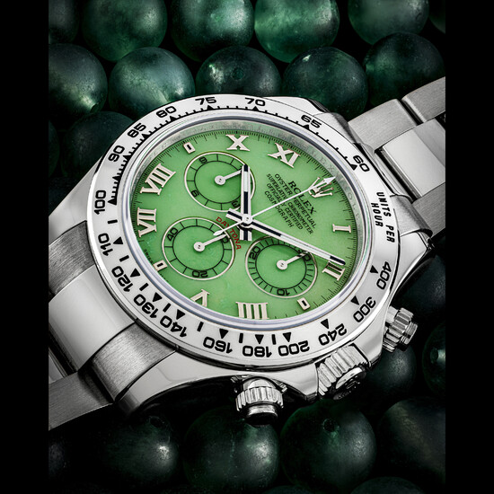 ROLEX. AN 18K WHITE GOLD AUTOMATIC CHRONOGRAPH WRISTWATCH WITH GREEN CHRYSOPRASE DIAL, BRACELET AND ADDITIONAL DIAMOND-SET BLACK DIAL WITH HANDS DAYTONA MODEL, REF. 116509, CIRCA 2006