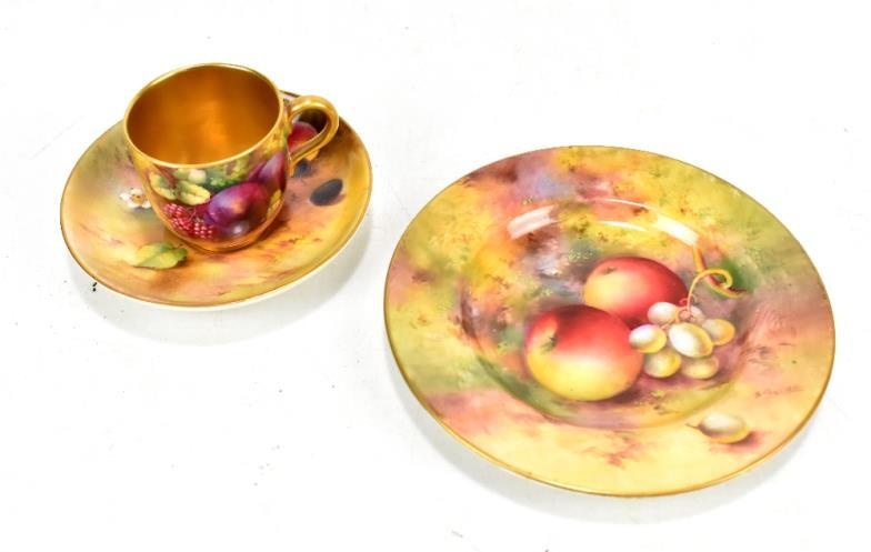 ROYAL WORCESTER; a matched fruit painted tea cup, saucer...