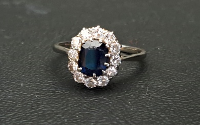 SAPPHIRE AND DIAMOND CLUSTER RING the oval cut sapphire appr...