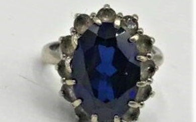 Sterling Silver Ring with Sapphire Surrounded by CZs