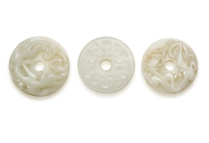 THREE SMALL CARVED WHITE JADE ARCHAISTIC DISCS, BI, QING DYNASTY (1644-1911)