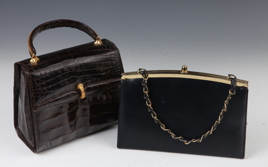TWO VINTAGE LEATHER BAGS WITH GOLD-TONE CHAIN. One navy blue...