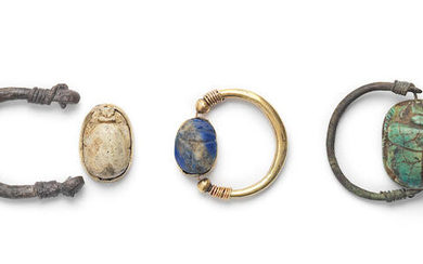 Three Egyptian rings with swivel scarabs