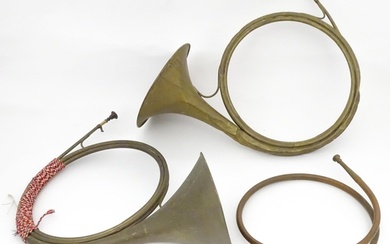 Three French hunting horns, comprising a brass horn by Gautr...