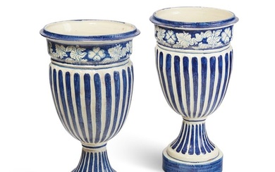 Two blue and white glazed ceramic garden urns