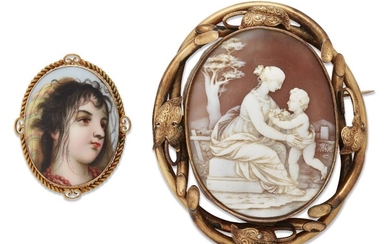Two brooches, one a Victorian gold mounted shell cameo brooch the oval cameo depicting a seated lady embracing an infant in the classical style, within gold foliate border of vines, length, 7.5cm; and an early 20th century Swiss enamel brooch, the...