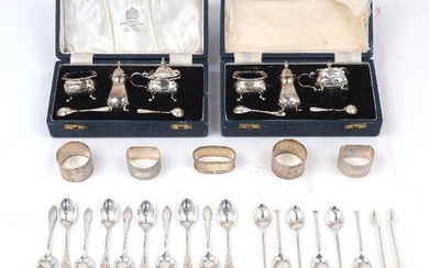 Two cased silver condiment sets by Mappin & Webb, Sheffield, 1969, the spoons in both sets are matched examples by Elkington & Co., Birmingham, 1968, each set comprising a blue glass lined salt, pepper and mustard with two condiment spoons...