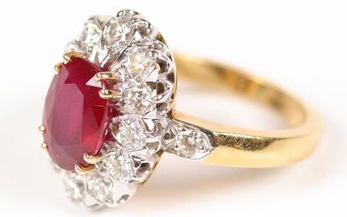Two gold (750) daisy ring centered on a ruby (9.7x7.3...