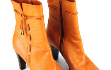BALENCIAGA - a pair of tan leather ankle boots.