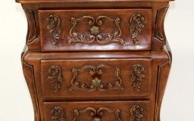 Carved mahogany bombe small chest of drawers