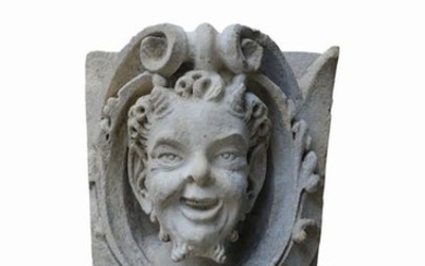 Dating from the 19th century, stone mascaron repre…