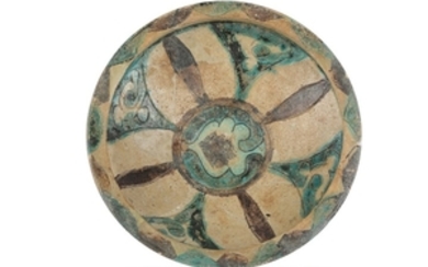 AN EARTHENWARE LAQQABI POTTERY DISH Possibly Syria, 12th...