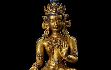 A gilt-bronze figure of Tara