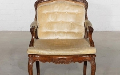 A Louis XV carved beechwood fauteuil