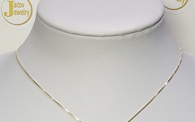14K yellow gold necklace and pendant set with a natural...