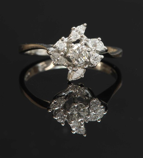 An 18ct white gold diamond cluster crossover ring