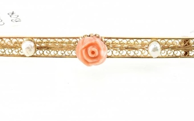 A FILIGREE BAR BROOCH SET WITH CARVED CORAL AND SEED PEARLS IN 18CT GOLD