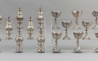EIGHT PAIRS OF ROCOCO-STYLE CHINESE EXPORT OR BRITISH COLONIAL SILVER OPEN SALTS AND PEPPER SHAKERS Pseudo British marks. Pierced sa...