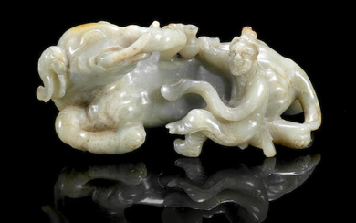 A mottled green jade carving of an elephant and foreigner