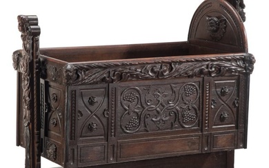 61011: A Renaissance Revival Carved Oak Swinging Cradle