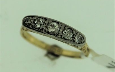 Five stone old cut diamond ring, graduated old cut diamonds mounted in white metal on an openwork yellow metal setting, stamped...