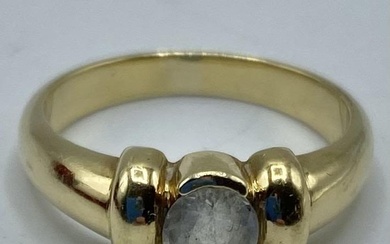A 14ct gold and white sapphire single stone ring,...