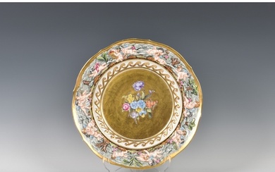A 19th century Capodimonte porcelain gilded cherub plate, re...
