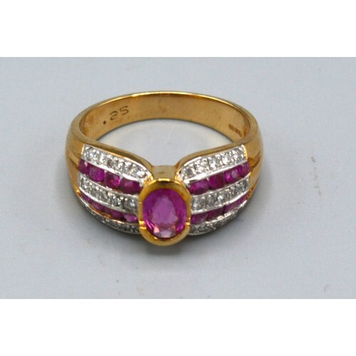 A 9ct. Gold Ruby and Diamond Ring with central oval ruby fla...