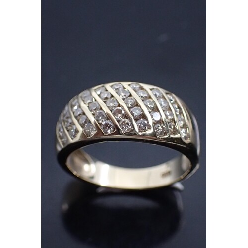 A 9ct gold ring set with diamonds, finger size O 4 grams