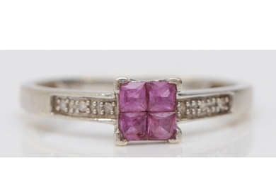 A 9ct white gold four Princess cut pink sapphire ring, diamo...