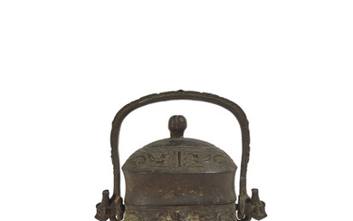 A CHINESE BRONZE RITUAL WINE VESSEL AND COVER, YOU, WESTERN ZHOU DYNASTY (1100-771 BC)
