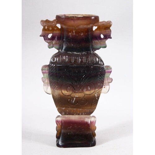A CHINESE CARVED AMETHYST STONE VASE - Carved in the form of...