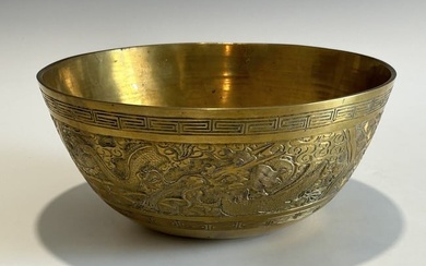 A CHINESE QING DYNASTY FINELY CARVED DRAGON AND PHOENIX BRASS BOWL, EARLY 19TH CENTURY