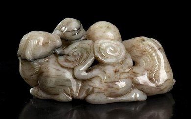 A CREAM AND DARK BROWN JADE GROUP WITH THREE RAMS AND