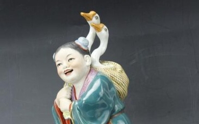A Chinese Porcelain Figurine of Boy Carrying Geese