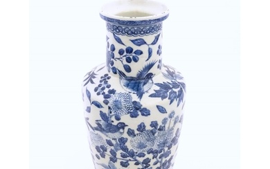 A Chinese blue and white vase decorated with flowers, foliag...