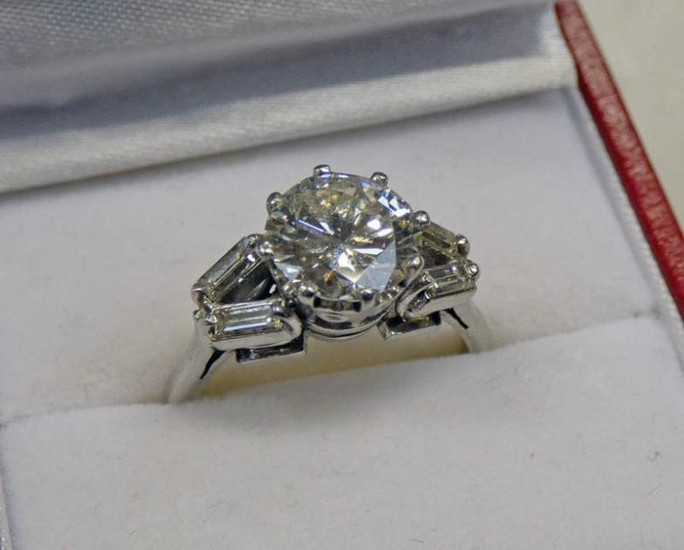 A DIAMOND SINGLE STONE RING, THE BRILLIANT -CUT DIAMOND...