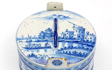 A Delft blue and white pottery lidded butter dish