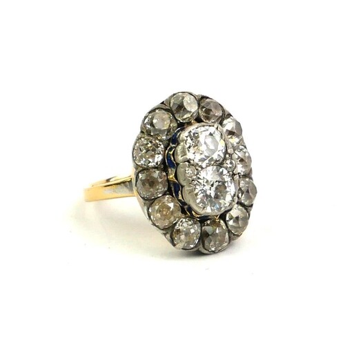 A GEORGIAN YELLOW METAL AND DIAMOND CLUSTER RING The pair of...
