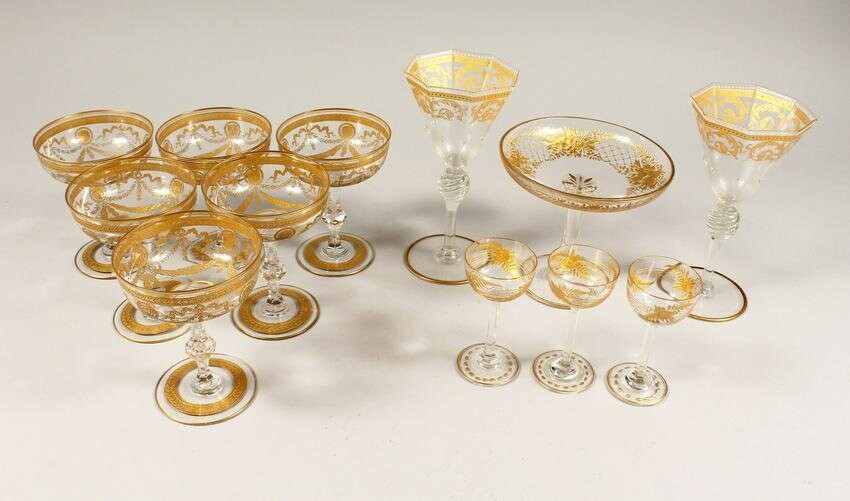 A GOOD SET OF SIX GILDED CHAMPAGNE GLASSES with ribbon