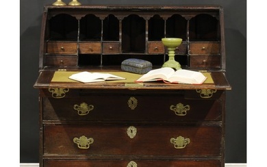 A George II oak bureau, fall front with reading ledge, enclo...