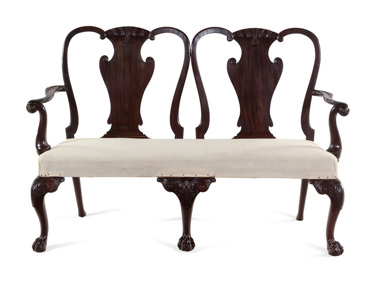 A George III Carved and Figured Mahogany Double-Chair Back Settee