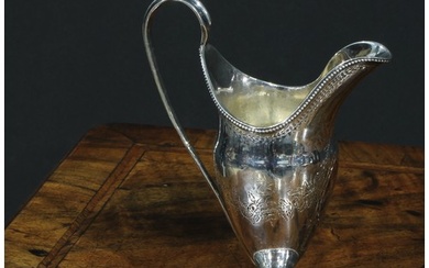 A George III Scottish silver helmet shaped pedestal cream ju...
